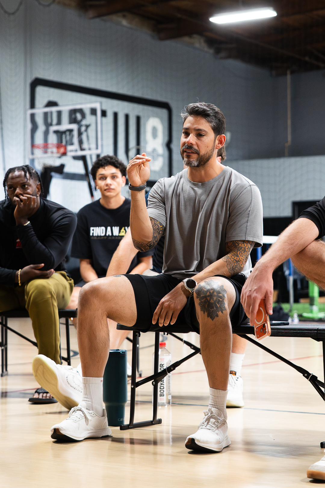 Coach Josh talking with players during a break